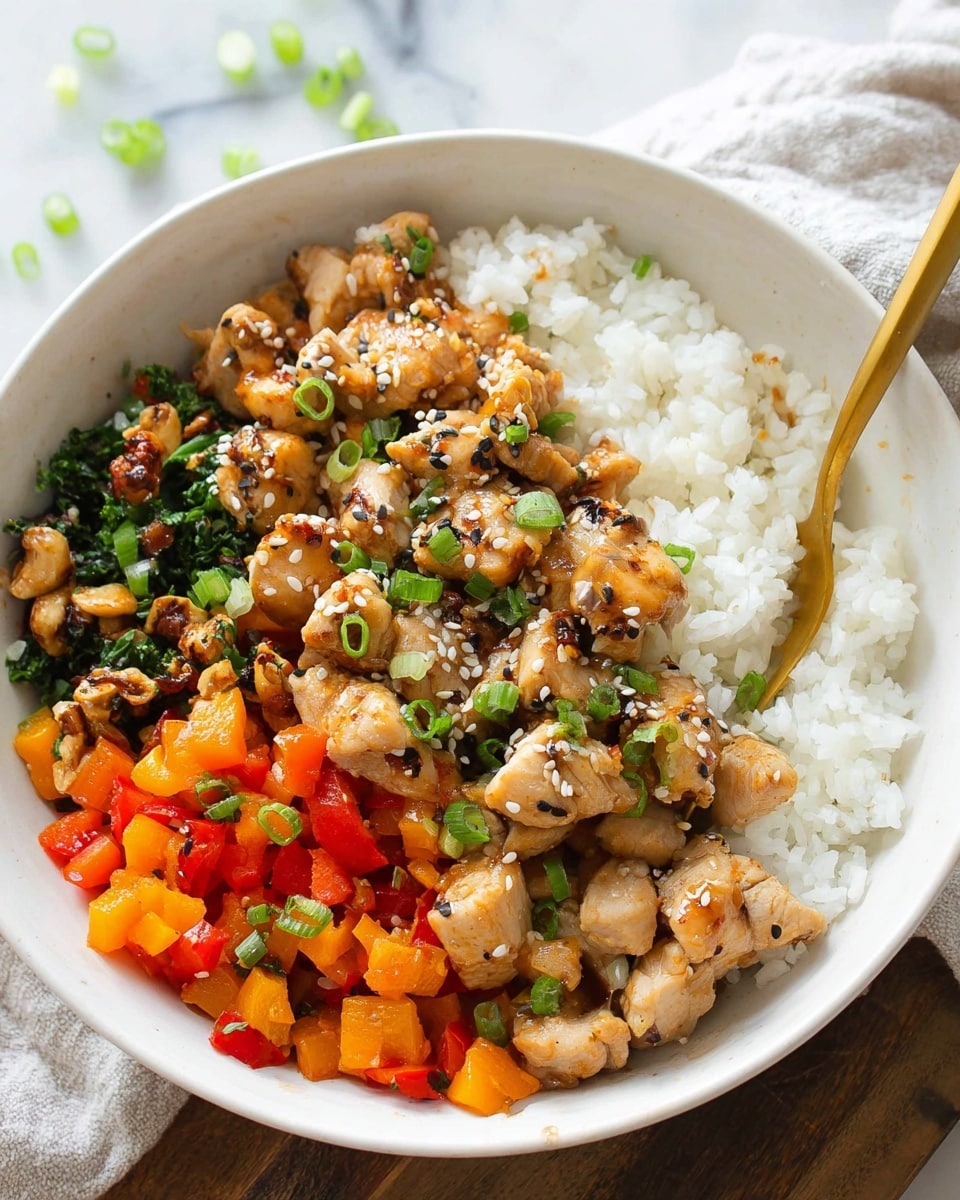 A white bowl holds three layers of food starting with a base of white steamed rice filling half the bowl, followed by a colorful stir-fried mix of diced orange and red bell peppers, nuts, and leafy greens on one side. On top, pieces of light brown cooked chicken sprinkled with white sesame seeds and chopped green onions cover the middle section. A gold spoon rests in the bowl angled from the top right corner. The bowl is placed on a white marbled surface with a few chopped green onions scattered nearby. Photo taken with an iphone --ar 4:5 --v 7