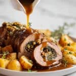 Slow-Roast Easter Stuffed Lamb with Herb-Pistachio Filling and Roasted Potatoes Recipe