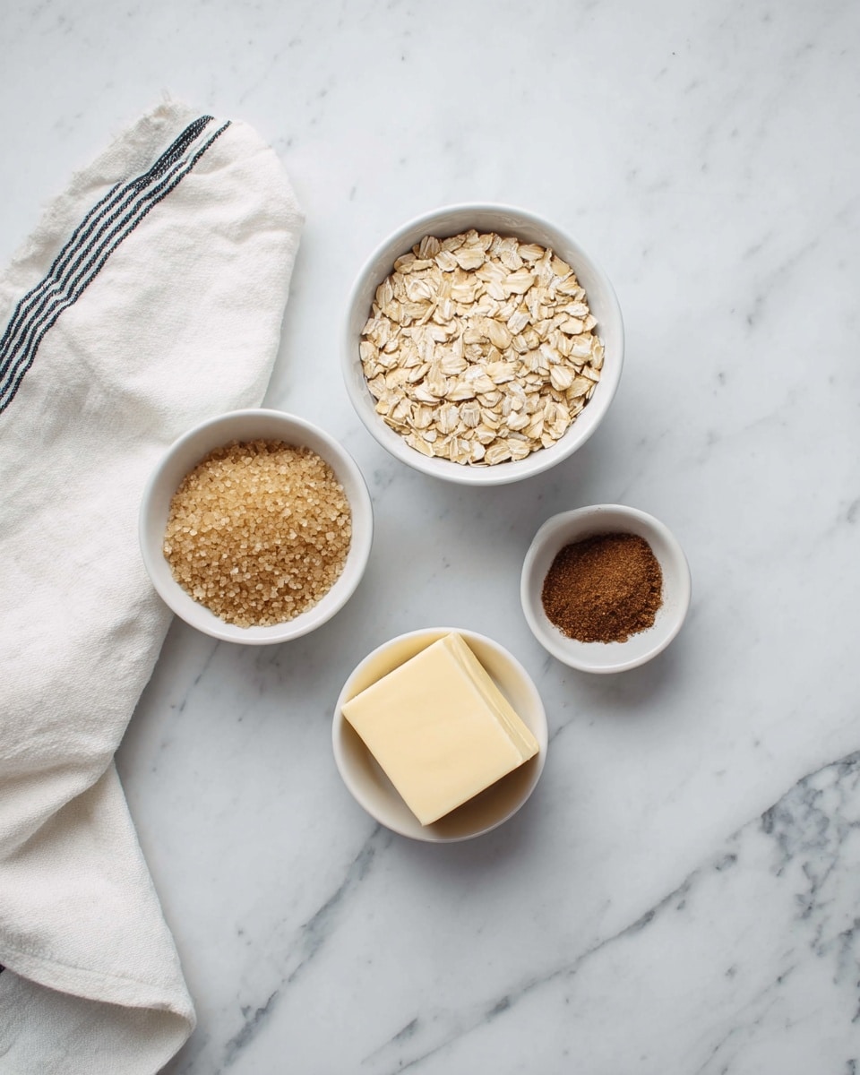 A top view on a white marbled surface with a white cloth with dark stripes on the upper left corner, holding four small white bowls arranged in a loose diamond shape. The largest bowl at the top is filled with light brown oats, the bowl on the left below it has light brown raw sugar, the bottom bowl contains a square piece of pale yellow butter, and the right bowl holds a small amount of dark brown cinnamon powder. photo taken with an iphone --ar 4:5 --v 7