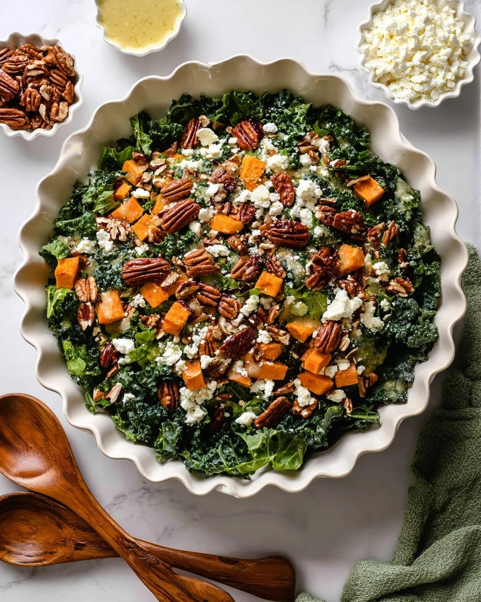 A large white scalloped bowl holds a colorful salad with three main layers: the bottom layer is dark green kale leaves that look fresh and slightly rough; the middle layer has bright orange roasted sweet potato chunks scattered evenly; the top layer is a mix of brown pecan halves and white crumbled cheese sprinkled all over. The salad is drizzled with a light yellow dressing. To the top left and right of the bowl, there are small white scalloped dishes, one filled with white cheese crumbles and the other with pecans. In the bottom left corner, two wooden serving spoons rest on the white marbled surface, and a green cloth napkin is just visible in the bottom right corner. Photo taken with an iphone --ar 4:5 --v 7