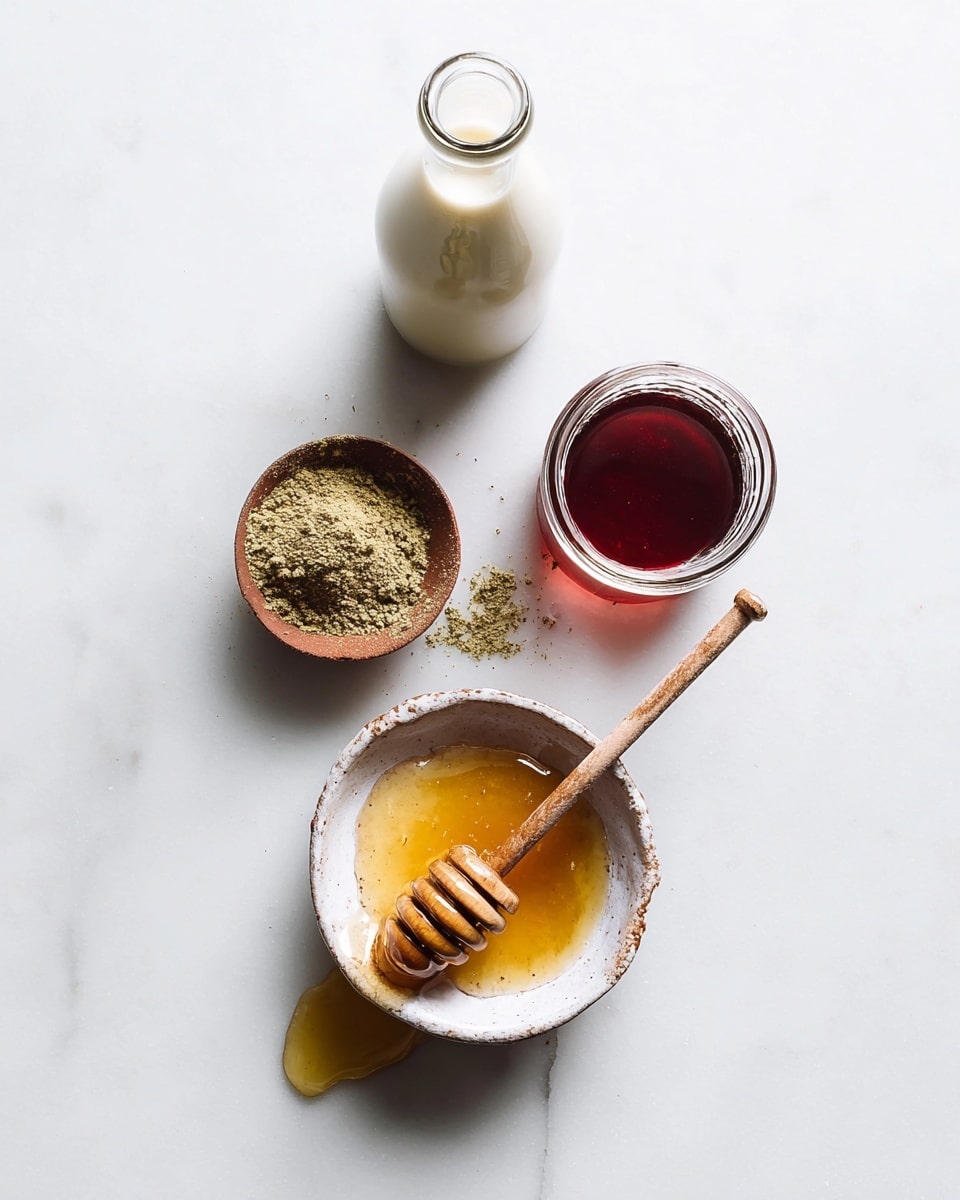 The image shows four items on a white marbled surface arranged vertically. At the bottom is a small white rustic bowl filled with golden honey, and a wooden honey dipper rests inside it with honey dripping onto the surface. Above it, there is a tiny brown bowl with a greenish powdered spice that has some powder spilled beside it. Next is a small clear glass jar filled with dark red liquid. At the top, there is a small clear glass bottle filled with creamy white liquid. The overall setting is simple and clean with natural lighting. photo taken with an iphone --ar 4:5 --v 7