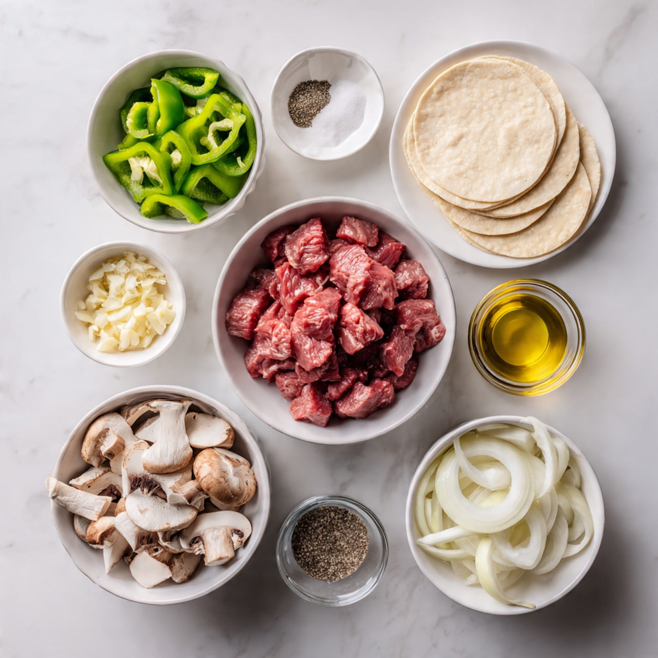 The image shows seven white bowls and plates arranged on a white marbled surface. In the center is a white bowl filled with raw cubed red meat with some white fat pieces. Above it to the right is a white plate with three smooth, round, pale beige dough circles slightly overlapping each other. To the left of that plate is a small white bowl with finely chopped pale yellow garlic. In the top left corner, a white bowl holds chopped green bell peppers with a shiny texture. Directly below it, another small white bowl contains a mix of white salt and black pepper. Below the meat bowl is a larger white bowl filled with sliced white and brown mushrooms showing their textured caps and gills. To the right of the mushrooms is a small clear glass bowl with golden olive oil. Above that bowl is a white bowl with thinly sliced white onion strips. The items are neatly spaced, with soft natural lighting highlighting the colors and textures. photo taken with an iphone --ar 4:5 --v 7