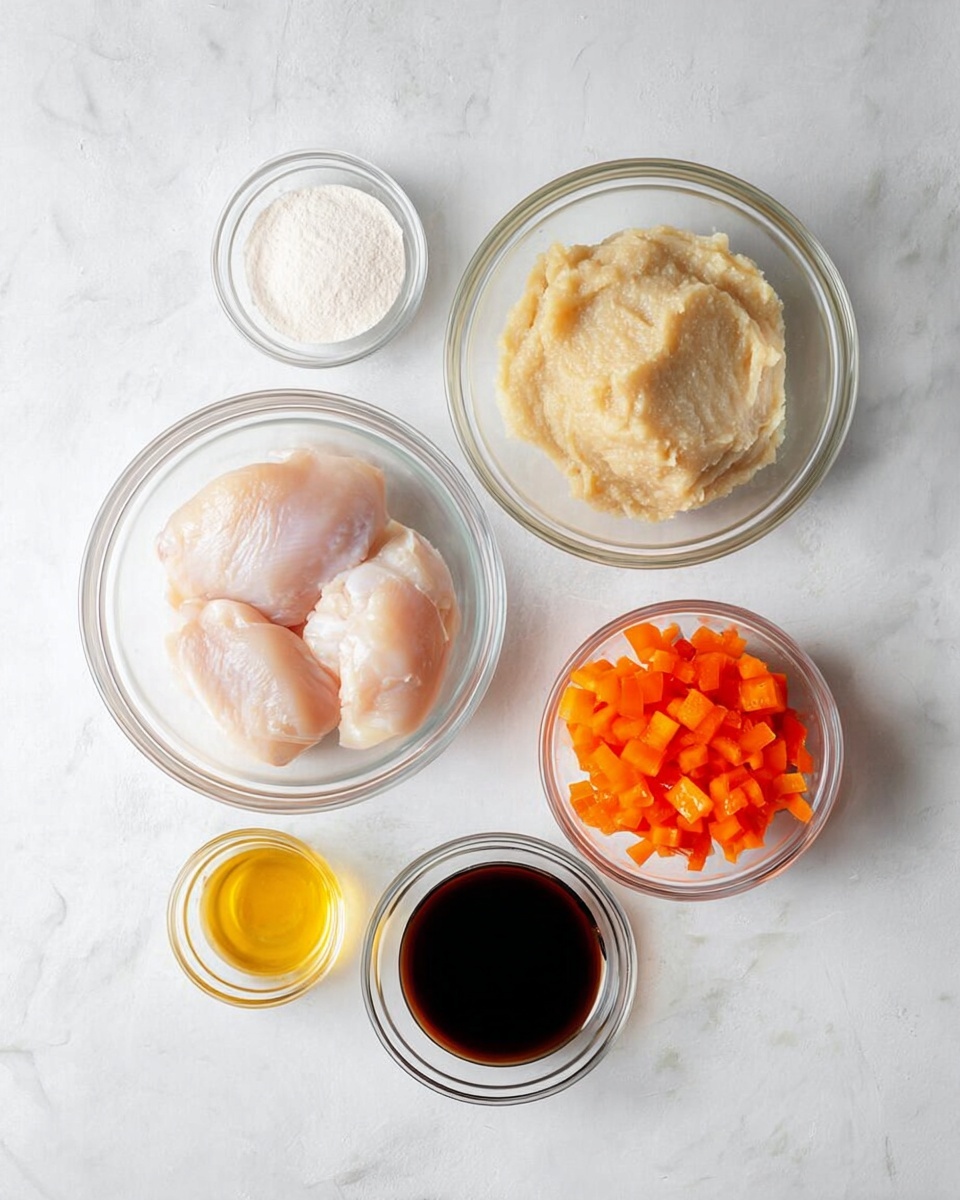 The image shows six clear glass bowls arranged on a white marbled surface. The largest bowl in the center holds three pieces of raw chicken with a pale pink color and smooth texture. Above it is another large bowl containing a light beige, slightly chunky puree. To the right of the puree is a medium bowl filled with bright orange diced bell peppers, showing a crisp texture. To the left of the chicken is a small bowl with a white powdery substance. Below the chicken, two small bowls hold golden-yellow liquid and dark brown liquid, each with a glossy surface. The setup is neat and clean with all bowls visible from above. Photo taken with an iphone --ar 4:5 --v 7