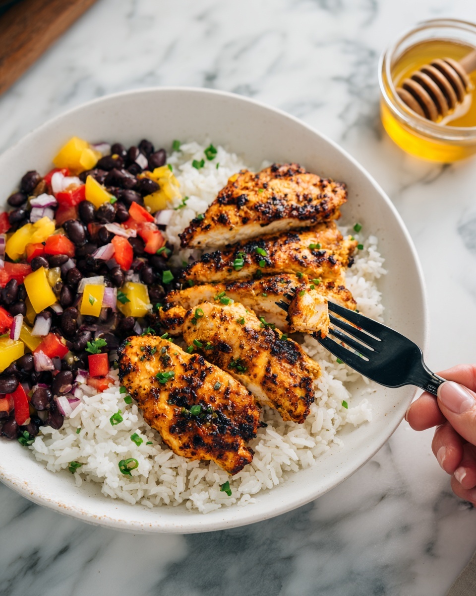 A white plate holds a bed of light, fluffy white rice that fills the base. On top, there are three pieces of grilled chicken with a golden brown and slightly charred texture, garnished lightly with chopped green onions. To the left side of the chicken, there is a colorful bean salad made of black beans, diced red tomatoes, yellow bell peppers, and bits of red onion, all mixed together. A black fork held by a woman's hand is lifting a piece of chicken from the plate. The dish sits on a white marbled surface, with a small glass bowl of honey and a honey dipper blurred in the background. photo taken with an iphone --ar 4:5 --v 7