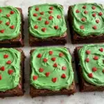 Grinch Brownies with Minty Green Frosting and Red Heart Sprinkles Recipe
